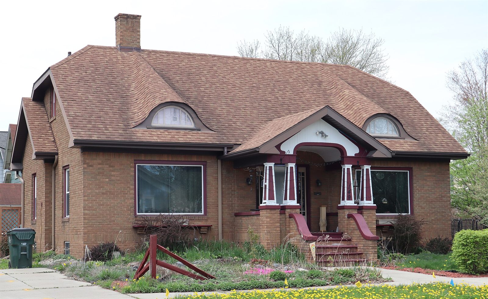 A frame bungalow with its date stone